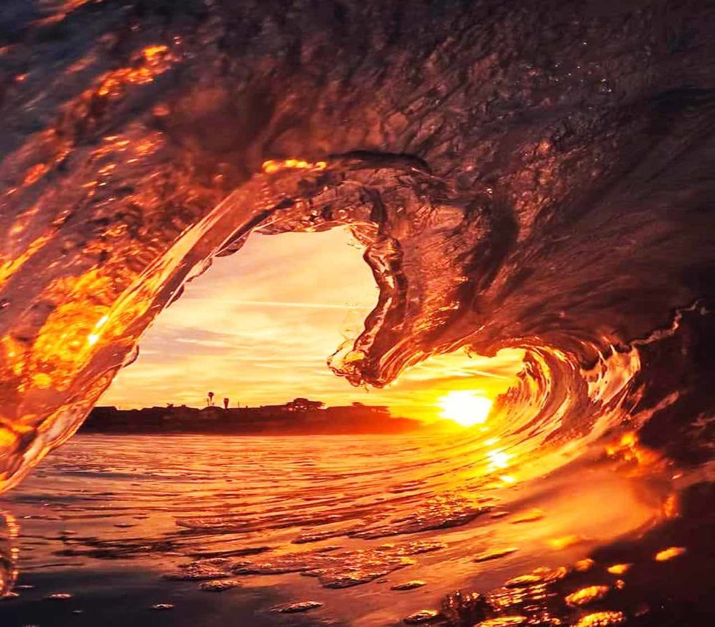 A heart-shaped wave at sunset