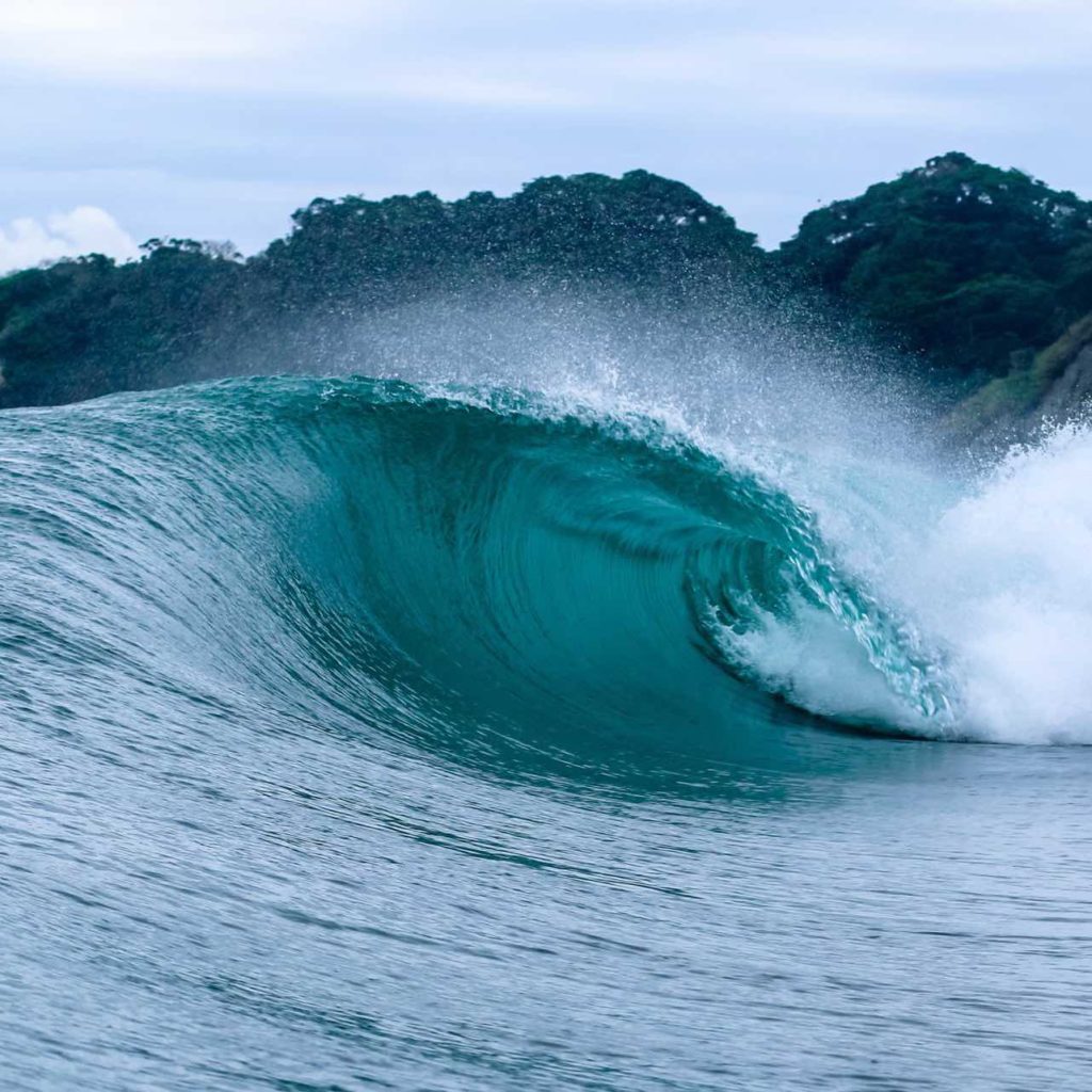 Giant wave at best surf spot Hebara in Japan
