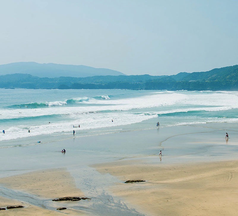 A beach and waves in the ocean in Shikoku, Japan