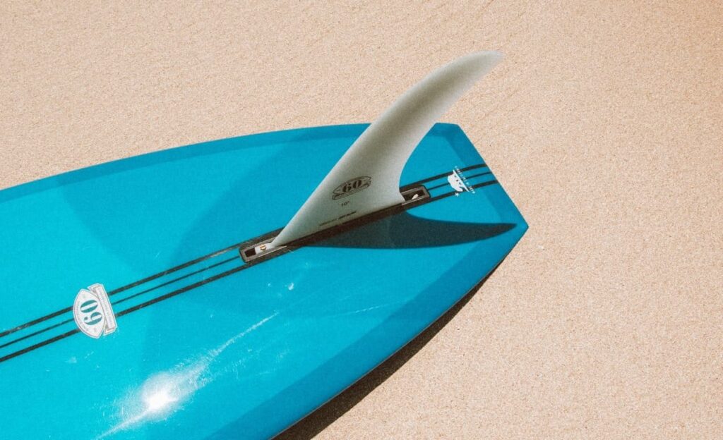 surfboard lying on the sand