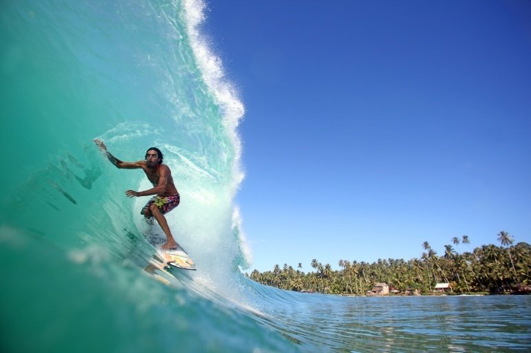 surfer in a barrel at Serangan - best surf spots in Bali, Indonesia