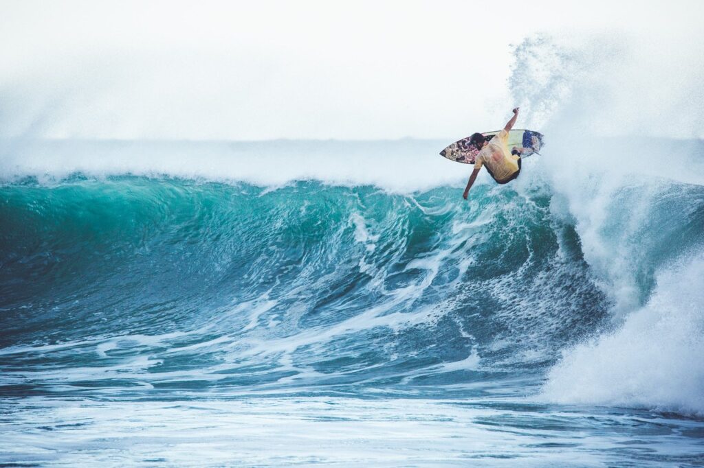 Surfer catching wave at Arugam Bay, Sri Lanka, South Asia